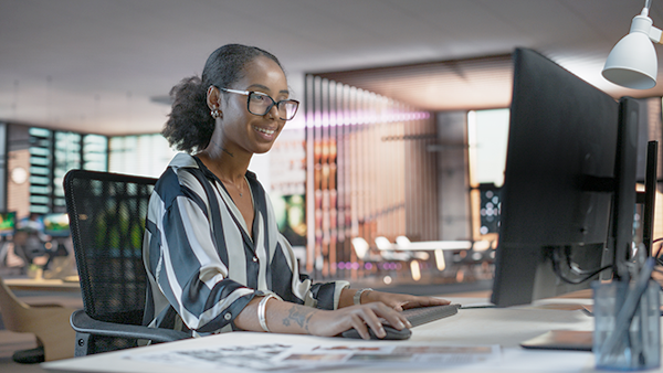 Woman game designer, using BOXX APEXX S3 workstation